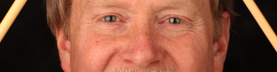 A close up of the face of an older man