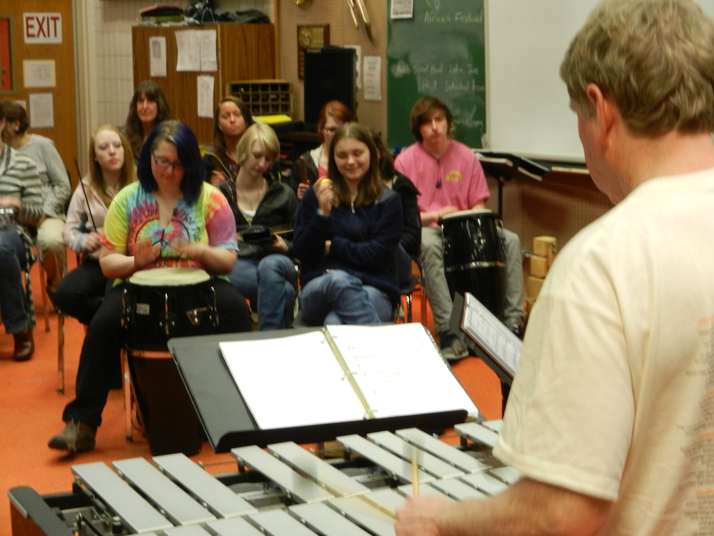 Photo of John Damberg teaching a group of students