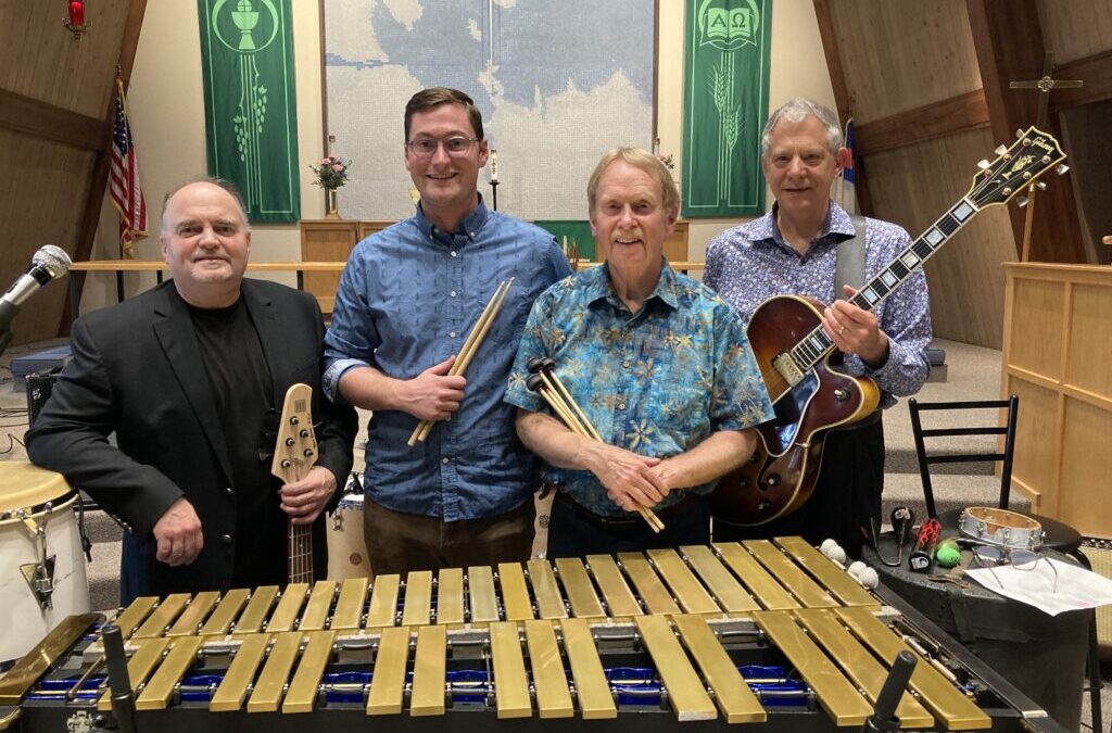 Jazz quartet performing with vibraphone.